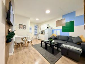 a living room with a couch and a table at The Skyline Luxury Unit in Bélanger