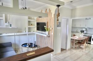 a kitchen and living room with a dining room at Adriana's Summer House in Kassiopi