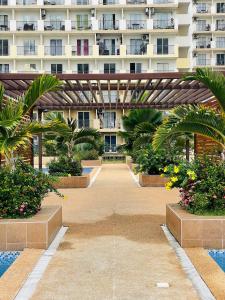 a large apartment building with a courtyard with plants at Saekyung Marigondon in Suba