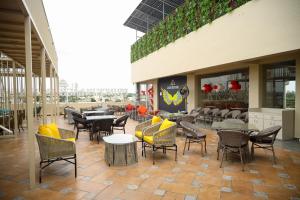 a restaurant with tables and chairs on a patio at Prince Palace And Banquet in Pāndharkawada