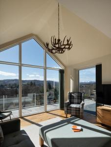a living room with a large window with a view at Sunny Ridge in Fort Augustus