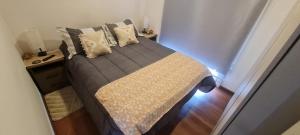 a bed in a small room with at Cabañas Bio Bio Osorno in Osorno