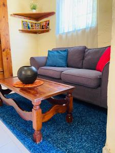 a living room with a couch and a coffee table at Mountain View Escape in Mbabane