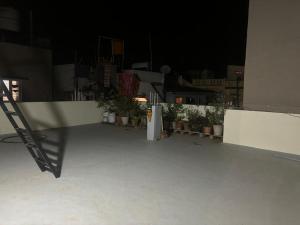 a white refrigerator on the side of a building at night at Satgiri Nest House in Chikmagalūr
