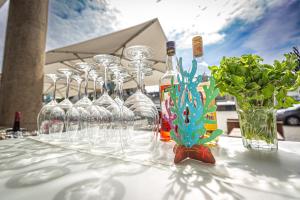 a table with wine glasses and a vase with flowers at Mintrops Stadt Hotel Margarethenhöhe in Essen +58 photos