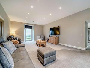 a living room with a couch and a tv at 3 Bed in Girvan oc-96394 in Girvan