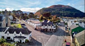 an aerial view of a small town with a mountain at Kerry Ocean Lodge Room only in Glenbeigh