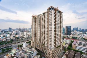 a tall building in the middle of a city at Apartment Luxury Center HCM City with Infinity Pool in Ho Chi Minh City