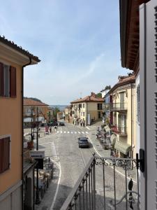 a view of a city street from a balcony at Il Cantun in Monforte dʼAlba