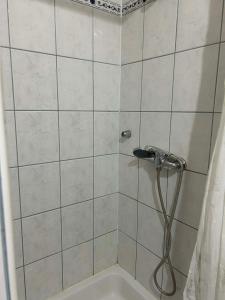 a bathroom with a shower with a shower head at Apartment Bačvice in Split
