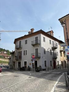 a white building on the side of a street at Il Cantun in Monforte dʼAlba