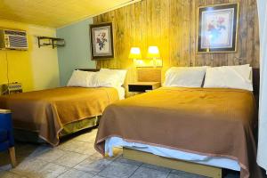 a hotel room with two beds in a room at Sparta Motel Near St Louis- Mississippi River IL in Sparta