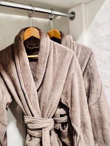 a robe hanging on a rack in a room at Kurna Mõis in Kurna +73 photos