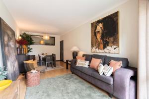 a living room with a couch and a table at Oceanfront Views & Modern Elegance by HostWise in Vila do Conde