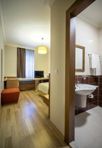 Postel nebo postele na pokoji v ubytování My Rose Hotel
