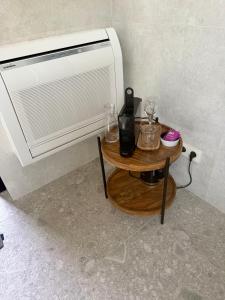 a table with glasses on it next to a air conditioner at The Box in Sint-Pieters-Leeuw
