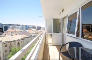 a balcony with a view of a city at Hotel Principe Lisboa in Lisbon