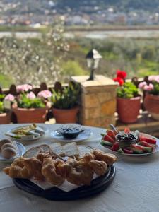 a table with plates of food on top of it at Hotel Panorama in Berat