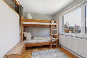 a bunk bed in a room with a window at Ferienwohnung glüxnest in Bernstadt +37 photos