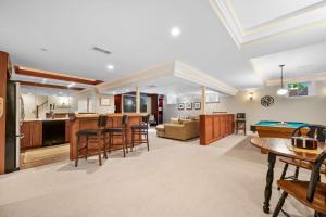 a kitchen and living room with a pool table at Walk to Beach and Town, Hot tub, Sleeps 8, Pet Friendly in Chatham