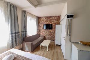 a small living room with a couch and a table at Angela Inn Boutique in Istanbul