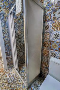 a shower stall in a bathroom with tiles at Angela Inn Boutique in Istanbul