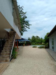 a building with a staircase next to a building at Casa Finca pasadia cerete in Cereté