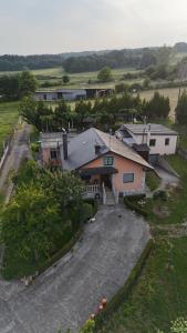 an aerial view of a house with a driveway at Albergue O Pombal in Sarria +18 photos