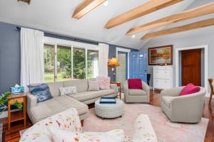 a living room with a couch and two chairs at Gorgeous Cape Cod Retreat Near Town Neck in East Sandwich