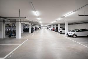 a large parking lot with cars parked in it at B&B HOTEL Basel in Basel +19 photos