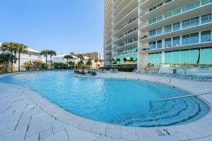 a large swimming pool in front of a building at Bella Luna 908 in Orange Beach