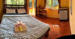 a bedroom with a bed with two bags on it at elephant garden in Ban Bang Bao +114 photos