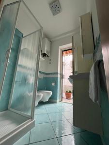 a bathroom with a shower and a sink and a toilet at La Casetta in Lacco Ameno +19 photos