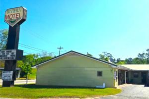 a motel sign in front of a building at Riviera Motel Elba Near Enterprise US 84 in Elba +17 photos