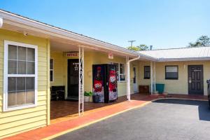 a building with two cocacola soda dispensers on it at Riviera Motel Elba Near Enterprise US 84 in Elba