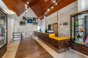 a bar in a restaurant with a brick wall at Rio Quente Resorts - Eco Chalés in Rio Quente