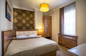 Postel nebo postele na pokoji v ubytování My Rose Hotel