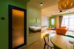 a room with a room with a bed and a table at Lot 78 in Malacca