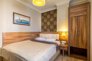 Postel nebo postele na pokoji v ubytování My Rose Hotel