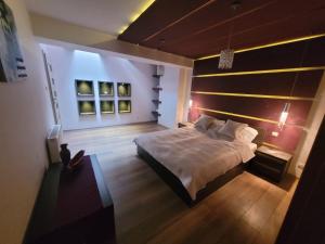 a bedroom with a large bed and a window at Lake Hill Giżycko in Giżycko