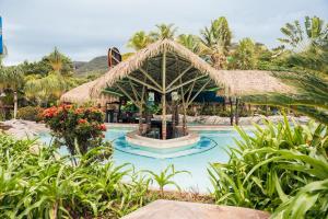 a resort with a fountain in the middle of a pool at Rio Quente Resorts - Eco Chalés in Rio Quente