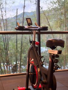 a bike parked in front of a window at Villa Jaliza - Luxury 7 bedroom Villa, Chaweng, Samui in Chaweng Noi Beach