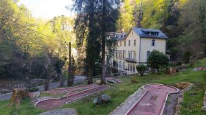 a house on the side of a hill with a house at Appartement 4 pers Montagne -draps et serviettes non fournis- in Eaux-Bonnes