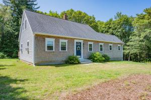 a small white house with a yard at Cape Cod Escape – 1 Mile to Beach, A/C Grill in Centerville
