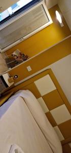 a room with a bed with a window at marte rooms in Centola
