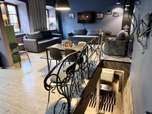 a living room with a table and chairs at Traku14 Old Town Yoga Studio in Vilnius