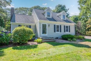 a small white house with a yard at On Cape Time – Family Friendly Relaxing Escape in Osterville +41 photos