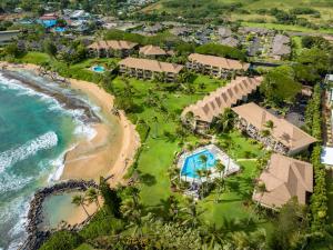 an aerial view of the resort and the beach at NEW Beachfront 2 Bedroom Ocean View Oasis and Pool in Kapaa