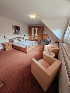 a large room with a bed and a couch at Bürgerstüble in Sankt Peter