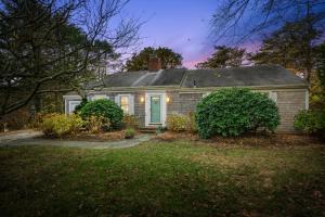 a small house with a lawn in front of it at Spacious Dog-Friendly Retreat in Chatham in Chatham